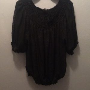 Black blouse with elastic button.